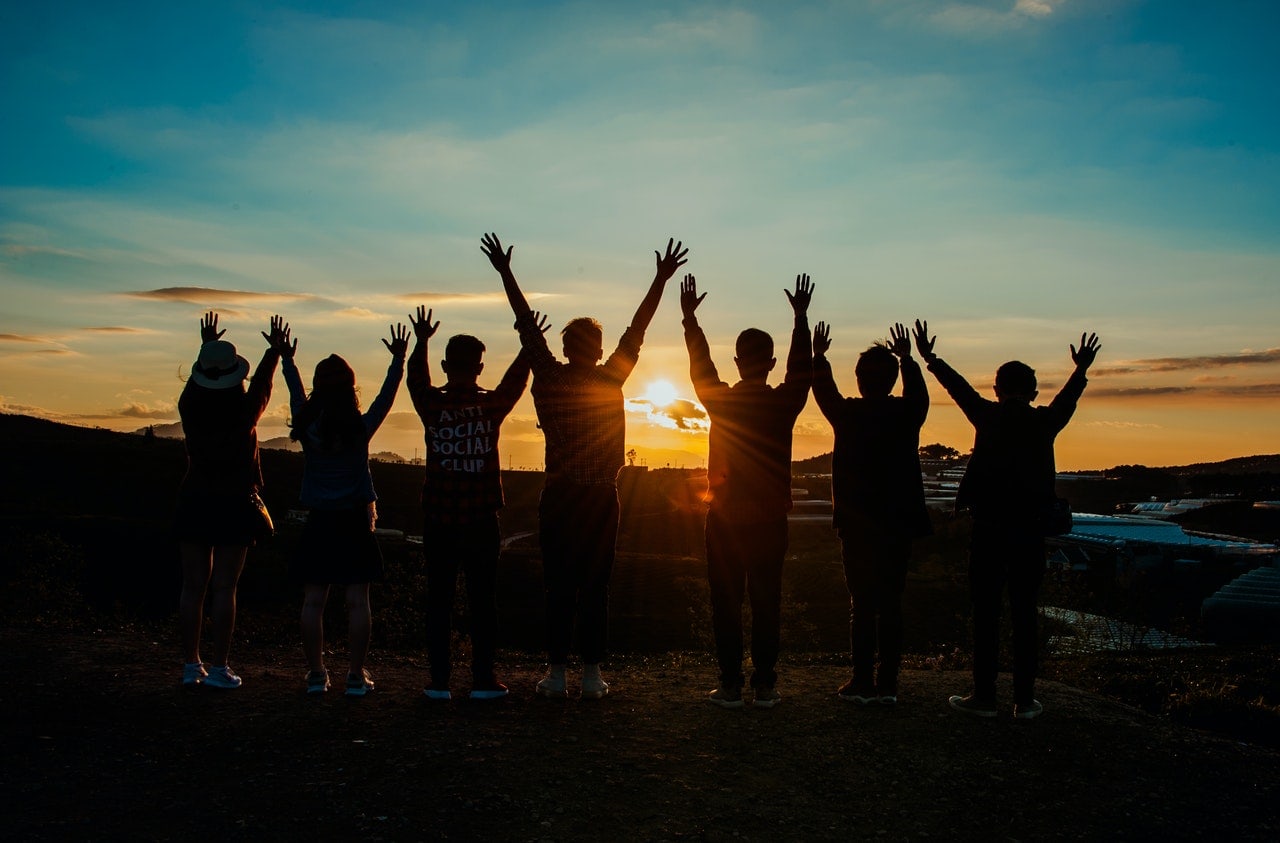 people during sunset small group