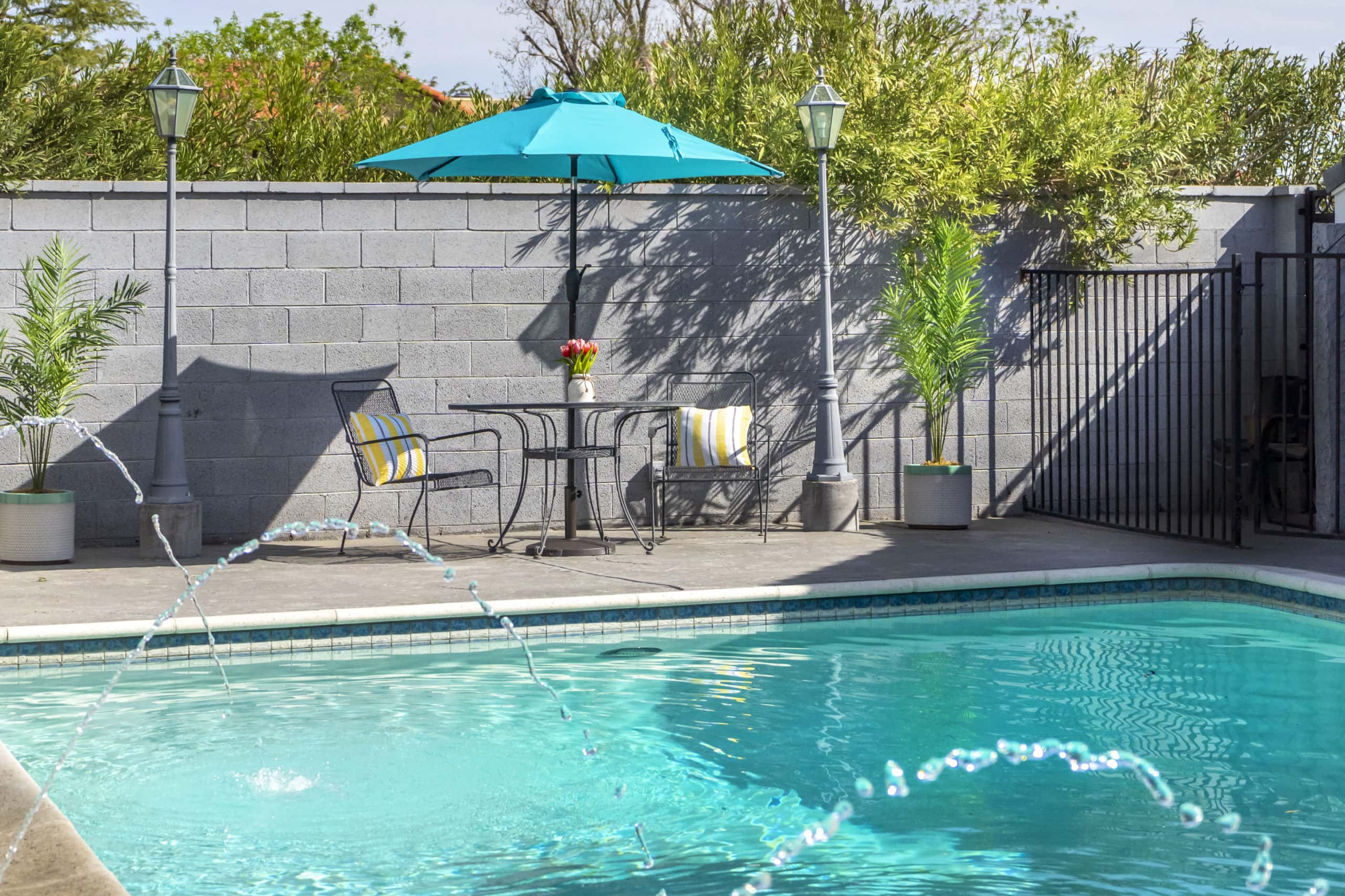 Tables and chairs beside the pool